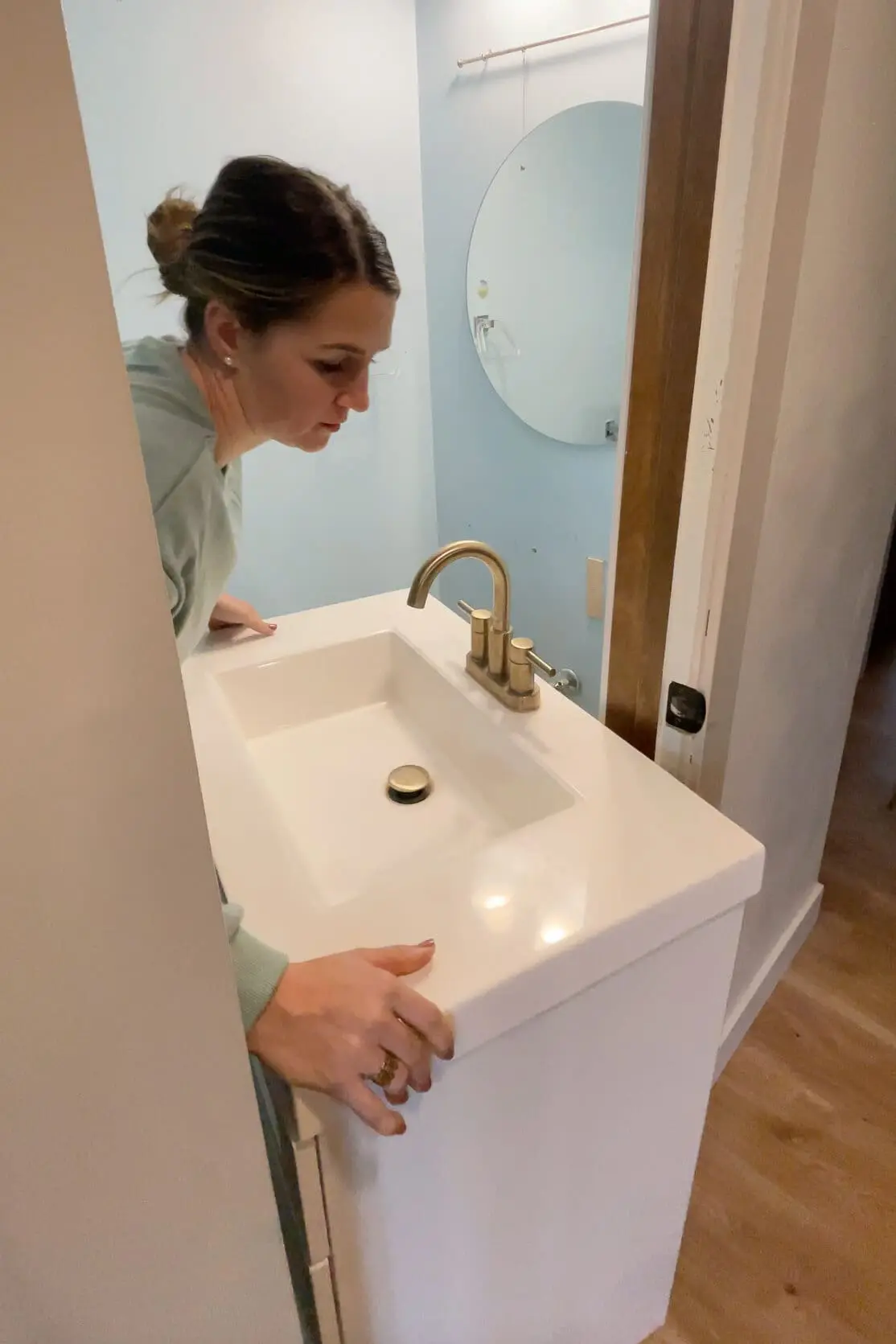 Removing a vanity from the bathroom.